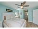 Spacious main bedroom with wood floors, ceiling fan, and an ensuite bathroom at 1800 Birmingham Blvd, Punta Gorda, FL 33980