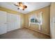 Bedroom featuring a large window, ceiling fan, and closet at 18702 Van Nuys Cir, Port Charlotte, FL 33948