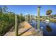 A wooden dock, providing private access to the waterfront and recreational boating at 18702 Van Nuys Cir, Port Charlotte, FL 33948