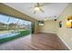 Beautiful living room features sliding doors that lead out to the pool and backyard at 18702 Van Nuys Cir, Port Charlotte, FL 33948