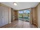 Living area featuring sliding glass doors to the pool and built-in shelving at 18702 Van Nuys Cir, Port Charlotte, FL 33948