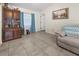 Comfortable living room area showcasing a cabinet, tiled floor, and a seating area at 188 Cypress Nw Ave, Port Charlotte, FL 33952