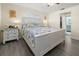 Calm bedroom features a large bed, light walls, and light gray wood-look flooring at 188 Cypress Nw Ave, Port Charlotte, FL 33952