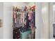 Walk-in closet with storage for clothes, totes, and personal belongings, next to the bathroom at 188 Cypress Nw Ave, Port Charlotte, FL 33952