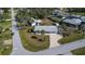 Aerial view of the property showing a well-maintained home with a large yard and surrounding neighborhood at 21192 Knollwood Ave, Port Charlotte, FL 33952