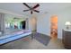 Bedroom featuring tiled floors and a ceiling fan at 21192 Knollwood Ave, Port Charlotte, FL 33952