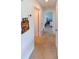 Bright hallway with tile flooring leading to the bedrooms at 21192 Knollwood Ave, Port Charlotte, FL 33952