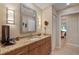 Granite counters, stylish mirror, attractive light fixtures and access to another room highlight this bathroom at 2284 Palm Tree Dr, Punta Gorda, FL 33950