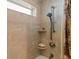 Shower featuring a handheld sprayer, small storage shelves and patterned curtain at 2284 Palm Tree Dr, Punta Gorda, FL 33950