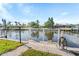 Picturesque waterfront view featuring a private dock, perfect for boating and enjoying waterfront living at 2284 Palm Tree Dr, Punta Gorda, FL 33950