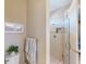 Bathroom with a glass enclosed shower, a framed picture and a plush towel at 2478 Brassica Dr, North Port, FL 34289