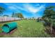 Enjoy the spacious, fenced dog park with play tunnel, bench and water station at 2478 Brassica Dr, North Port, FL 34289