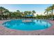 Inviting outdoor pool area with lounge chairs and shaded cabana for relaxation at 2478 Brassica Dr, North Port, FL 34289