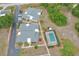 An aerial view shows the property's layout, including the buildings, parking area, and screened-in pool at 25068 Harborview Rd # 3B, Punta Gorda, FL 33980