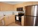 Modern kitchen with stainless steel appliances and beautiful cabinetry at 255 West End Dr # 1302, Punta Gorda, FL 33950