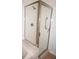 Shower with glass door and metal trim; safety bar and white tile at 255 West End Dr # 1302, Punta Gorda, FL 33950