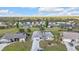 Elevated view of a residential area, highlighting spacious properties with verdant lawns and inviting outdoor spaces at 26166 Paysandu Dr, Punta Gorda, FL 33983