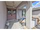 Front entrance with double doors and storm doors, columned supports, and porch at 26166 Paysandu Dr, Punta Gorda, FL 33983