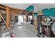 Living room being renovated with exposed framing, and a view to other areas of the home at 26166 Paysandu Dr, Punta Gorda, FL 33983