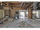 Living room being renovated with exposed framing, and a view to other areas of the home at 26166 Paysandu Dr, Punta Gorda, FL 33983