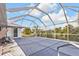 Covered pool with lounge chair and backyard view at 26166 Paysandu Dr, Punta Gorda, FL 33983