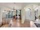 Inviting living area showcasing tile flooring and a seamless transition to a cozy office nook at 2639 Hobblebrush Dr, North Port, FL 34289