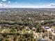 Scenic aerial view of the property showcasing its lush surroundings, waterfront access, and proximity to the wider community at 27385 Neaptide Dr, Punta Gorda, FL 33983