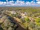 An aerial view of the property shows the lot lines, canal frontage and the surrounding neighborhood at 27385 Neaptide Dr, Punta Gorda, FL 33983