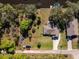 An aerial view of the property, with a verdant lawn and a charming waterway for boat enthusiasts at 27385 Neaptide Dr, Punta Gorda, FL 33983