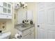 Bathroom showcases a single sink vanity with modern fixtures and ample storage at 27385 Neaptide Dr, Punta Gorda, FL 33983