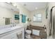 Bathroom features a large soaking tub and an updated single sink vanity at 27385 Neaptide Dr, Punta Gorda, FL 33983