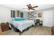 Bright bedroom features a comfortable bed, neutral tones and stylish decor at 27385 Neaptide Dr, Punta Gorda, FL 33983