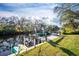 Private dock with boat, canoes, and lush greenery with water view, and serene ambiance at 27385 Neaptide Dr, Punta Gorda, FL 33983