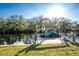 View of private boat dock with lift on canal, perfect for enjoying waterfront living and easy boat storage at 27385 Neaptide Dr, Punta Gorda, FL 33983