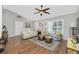 Cozy living room featuring ample natural light, hardwood floors, and a neutral color scheme at 27385 Neaptide Dr, Punta Gorda, FL 33983