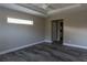 Bright and airy bedroom featuring wood-look floors, a ceiling fan, and neutral paint at 342 Sweetwater Dr, Rotonda West, FL 33947