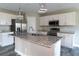 Modern kitchen with granite counters, stainless steel appliances, and a large island at 342 Sweetwater Dr, Rotonda West, FL 33947