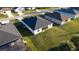 Aerial view of a well-maintained home with a large backyard and dark roof at 342 Sweetwater Dr, Rotonda West, FL 33947