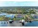 Aerial view of waterfront property featuring a pool, dock, and boat lift at 349 Springview Nw Cir, Port Charlotte, FL 33948