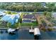 Aerial view of screened pool, home, and dock at 349 Springview Nw Cir, Port Charlotte, FL 33948