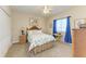 Serene bedroom with patterned bedding, a wicker nightstand, and soft lighting, creating a peaceful retreat at 349 Springview Nw Cir, Port Charlotte, FL 33948