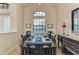 Formal dining room with natural light, high ceilings, and a table set for six at 349 Springview Nw Cir, Port Charlotte, FL 33948