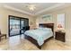 Main bedroom featuring a bed, nightstands and a private lanai, complete with beautiful waterfront views at 349 Springview Nw Cir, Port Charlotte, FL 33948