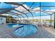 Screened pool with a view of the water and dock at 349 Springview Nw Cir, Port Charlotte, FL 33948