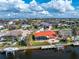 Stunning waterfront home featuring a private pool, dock, and beautiful orange roof at 35 Sabal Dr, Punta Gorda, FL 33950