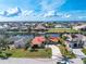 Aerial view of a single-story home featuring a red metal roof, located in a waterfront community at 35 Sabal Dr, Punta Gorda, FL 33950