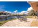 Backyard patio area with an outdoor dining table and waterfront views at 35 Sabal Dr, Punta Gorda, FL 33950