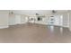 Expansive living room with tile floors, leading to kitchen and outdoor patio at 35 Sabal Dr, Punta Gorda, FL 33950