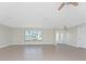 Bright and airy living room with tile flooring and large windows at 35 Sabal Dr, Punta Gorda, FL 33950