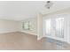 Bright living room featuring tile flooring, neutral walls and a large double door entryway at 35 Sabal Dr, Punta Gorda, FL 33950